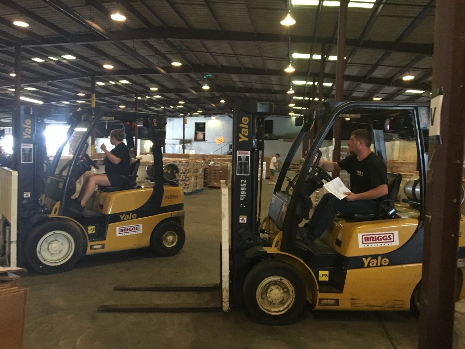 Forklifts parked in a warehouse.